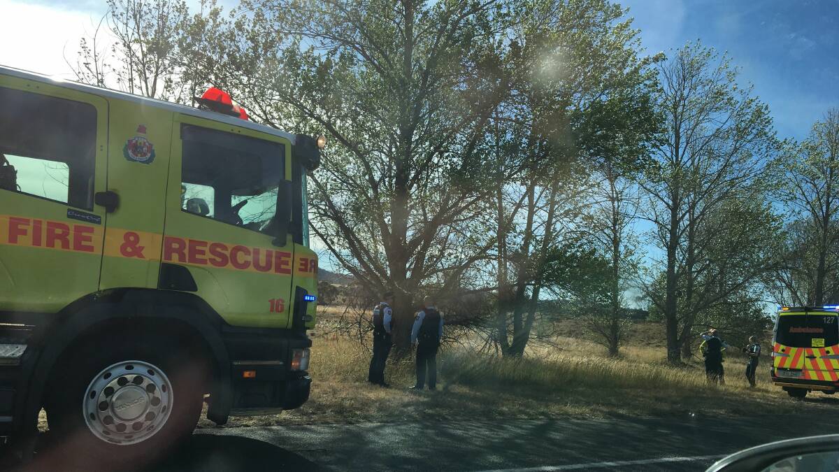 Emergency services attend a single car crash on the Monaro Highway on Friday. Picture: Sherryn Groch