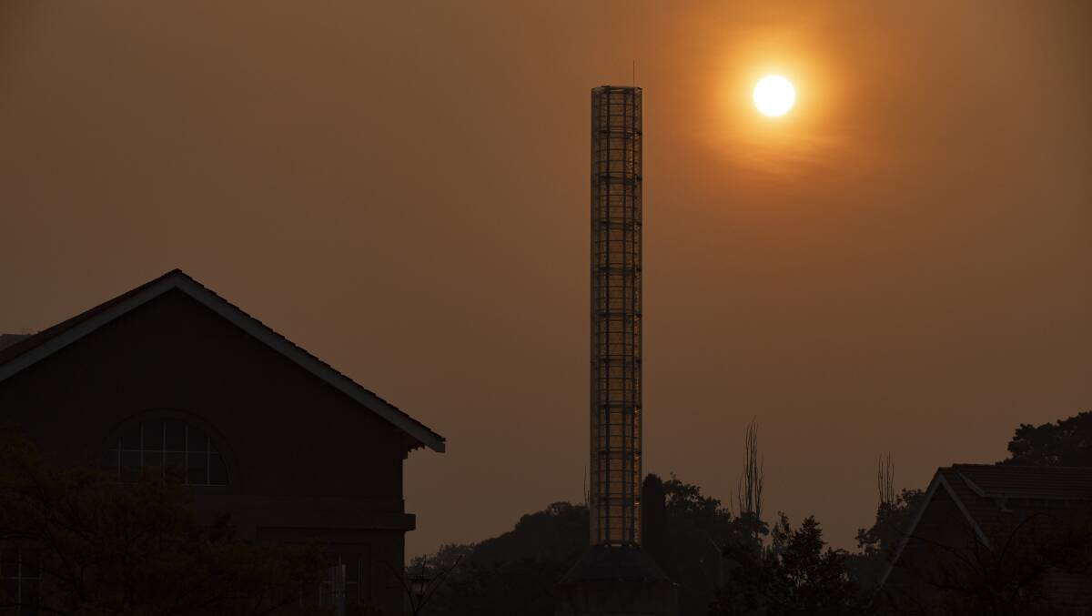 The suns sets over Canberra Glassworks in Kingston after Canberra was shrouded in smoke. Picture: Sitthixay Ditthavong
