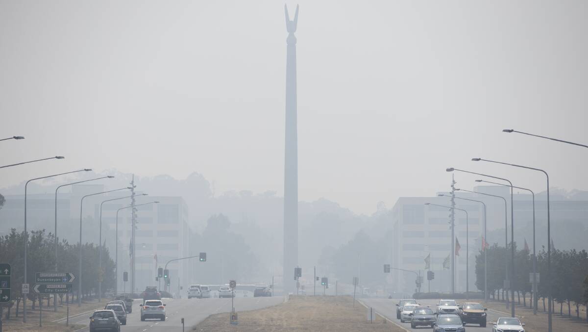 The Australian-American Memorial was silhouetted in smoke haze on Monday morning. Picture: Sitthixay Ditthavong