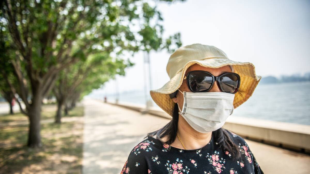 Julie Chen bought a mask on her way into work after hearing the health warnings. Picture: Karleen Minney