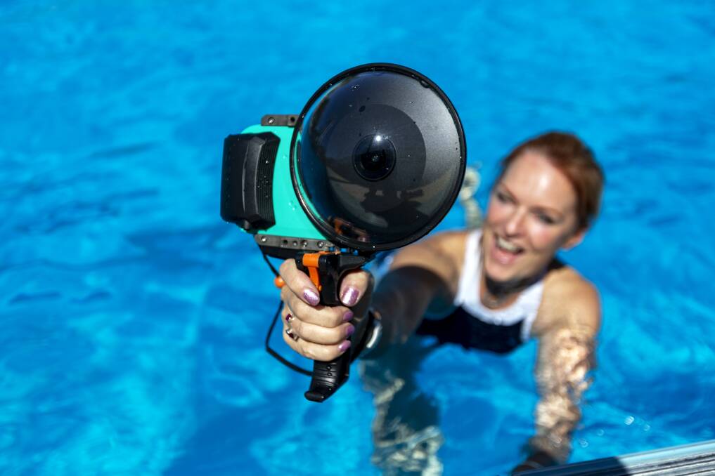 Canberra Times photographer Karleen Minney tries out the Axisgo iPhone underwater system. Picture: Sagi Bederman