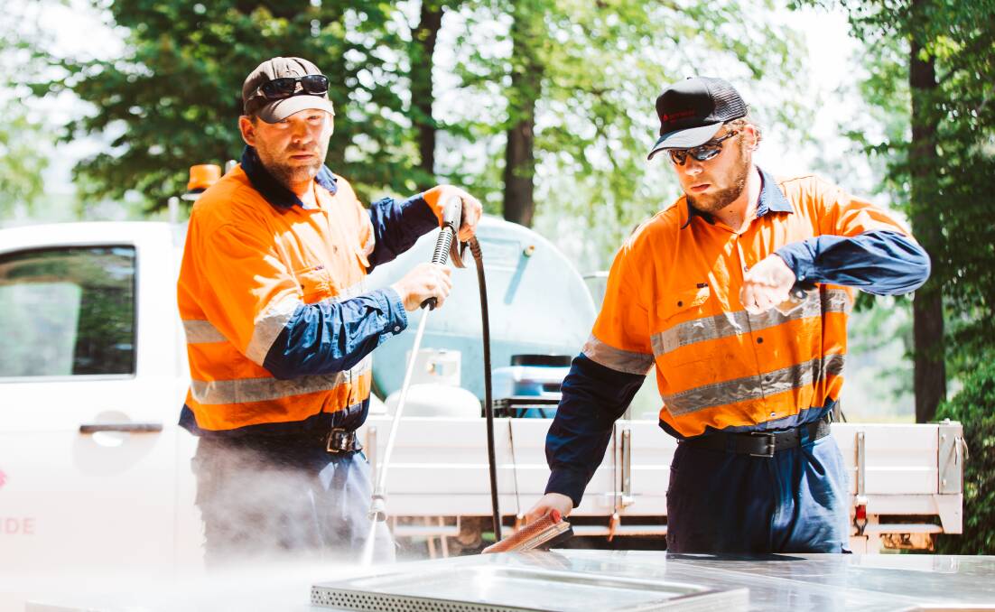 City services staff Aaron and Shane Foster, who are father and son and will be working outdoors during the hot summer period in Canberra. Picture: Jamila Toderas