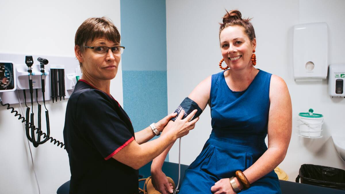 Nurse Kirsty Cummin with patient Skye Smolenaars at the opening of the new Weston Creek walk-in centre. Picture: Jamila Toderas