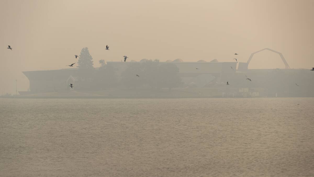 The National Museum of Australia is obscured by smoke haze on Tuesday afternoon. Picture: Sitthixay Ditthavong