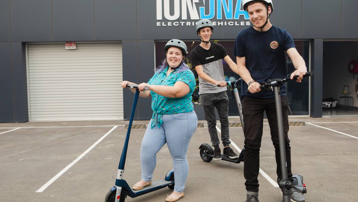 An e-scooter share scheme will launch in Canberra next month. Center, Taylor Jones 23, and (behind) RIley English 19, and Nick Diggins 23. Picture: Jamila Toderas