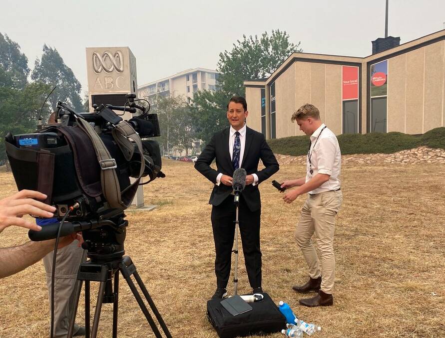 Smoke forced the evacuation of ABC Canberra's newsroom minutes before the 7pm bulletin, leading to a last-minute outside broadcast. Picture: ABC Canberra/Twitter