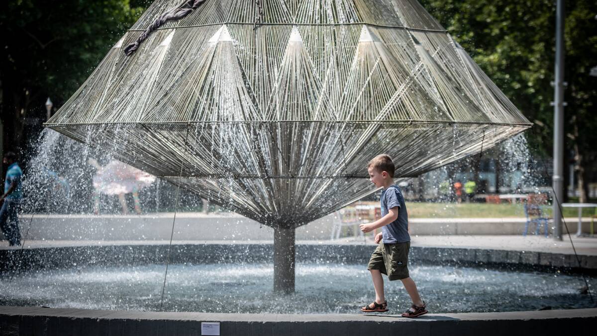 Four-year-old Leo Klein, of Moncreiff, tempted by the Canberra Times fountain in Civic on a sweltering summer's day. Picture: Karleen Minney