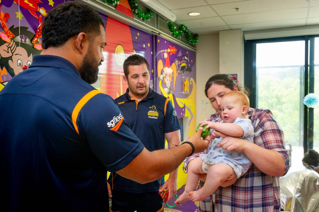 Brumbies players Scott Sio and Connal McInerney visit The Canberra Hospital, meeting with Rebekah Burt and mum Cass. Picture: Elesa Kurtz