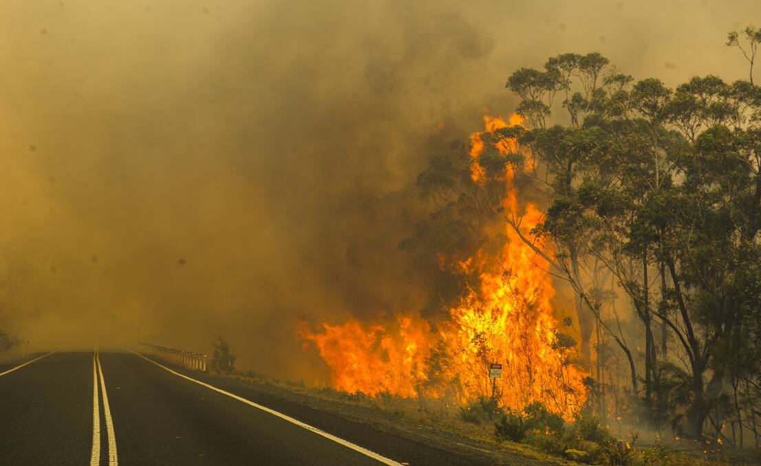 The Tianjara Fire flares up along Braidwood Road on Friday. Picture: Dion Georgopoulos
