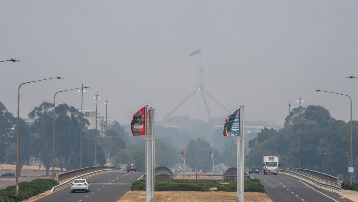 Bushfire smoke continues to blanket Canberra making Parliament House barely visible, with extremely hazardous air quality levels recorded on Saturday. Picture: Karleen Minney