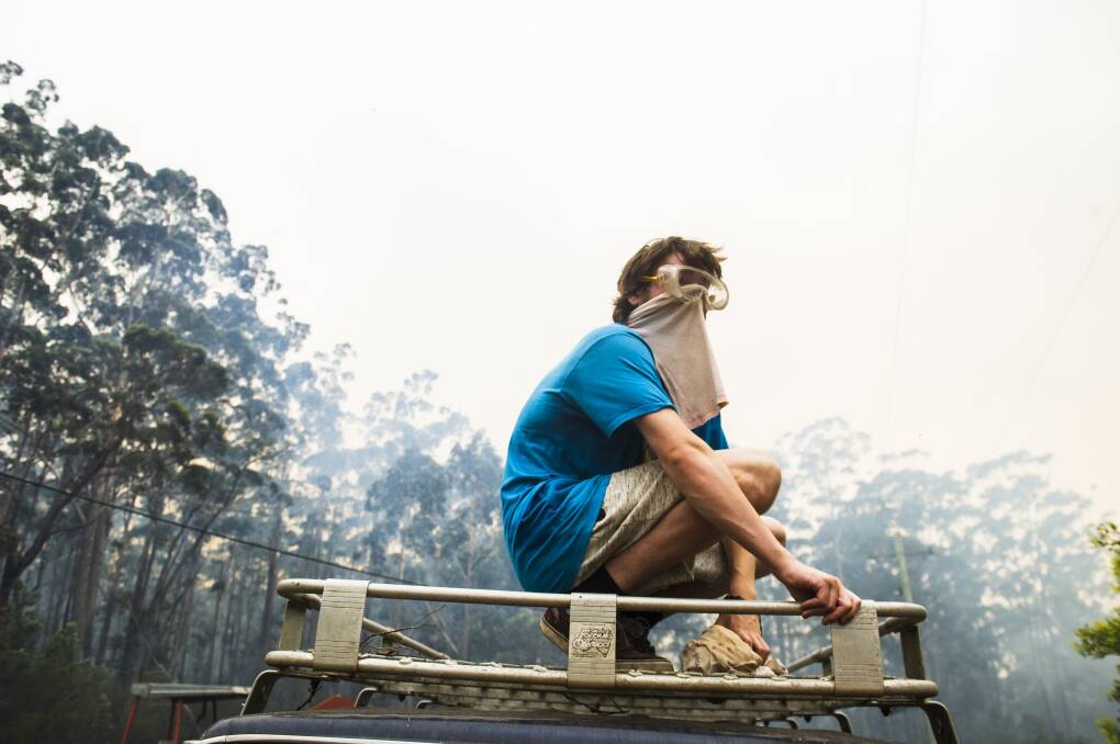 Liam Shubert stayed to protect his family's property on Tallow Wood Rd from the Currowan fire. Picture: Dion Georgopoulos