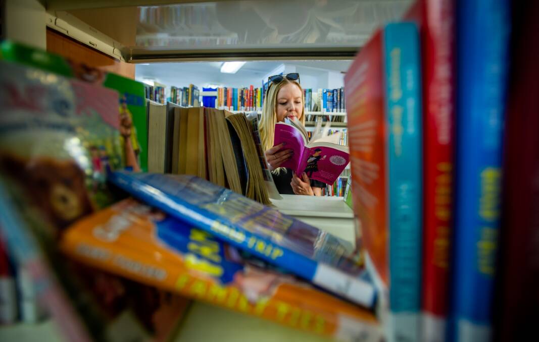 Kate Davey of Kaleen reads The Joyful Frugalista by Serina Bird at the Dickson library. PIcture: Karleen Minney