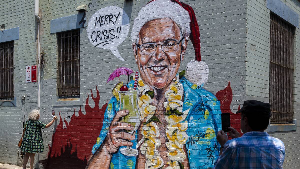 A mural depicting Prime Minister Scott Morrison on holiday in Hawaii painted by a Sydney artist. Picture: Getty Images.