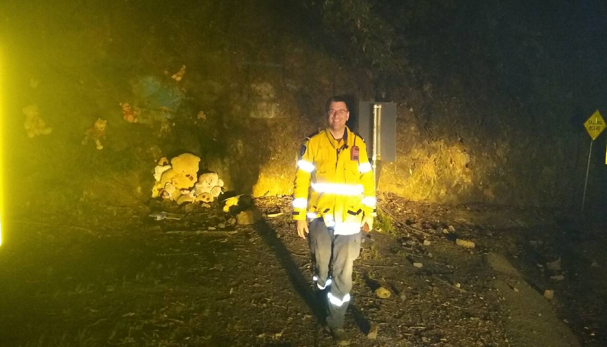An RFS firefighter stands in front of Pooh's Corner on the Clyde Mountain in a picture posted online by the Carwoola Rural Fire Brigade. Picture: Facebook