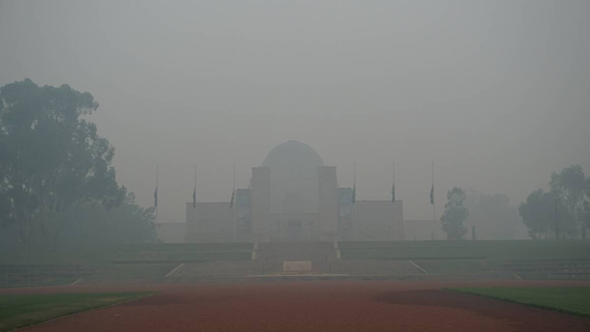 The War Memorial barely visible from a thick smoke haze that has impacted Canberra. Picture: Megan Dingwall