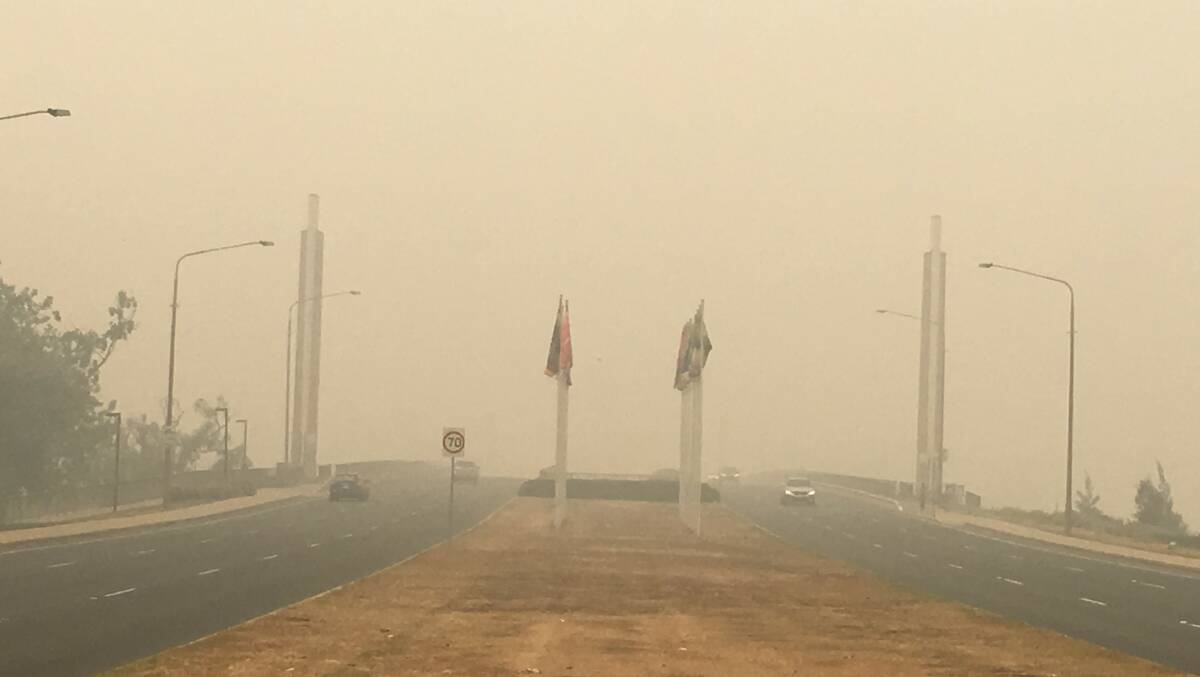 Commonweath Avenue bridge in Canberra blanketed in smoke haze on Wednesday. Picture: Peter Brewer