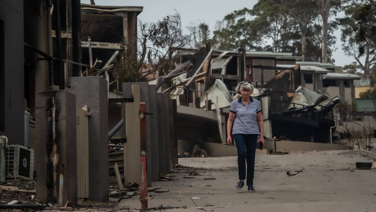 Susan Magnay gets a first look at the home of she and husband Philip Bell in their apartment complex lost to fire in Malua Bay. Picture: Karleen Minney