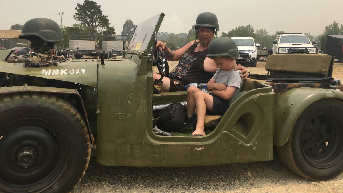 Matt Killen and his "unhappy soldier", six-year-old son Beau in their home-made Willys Jeep at Summernats 2019. Picture: Peter Brewer