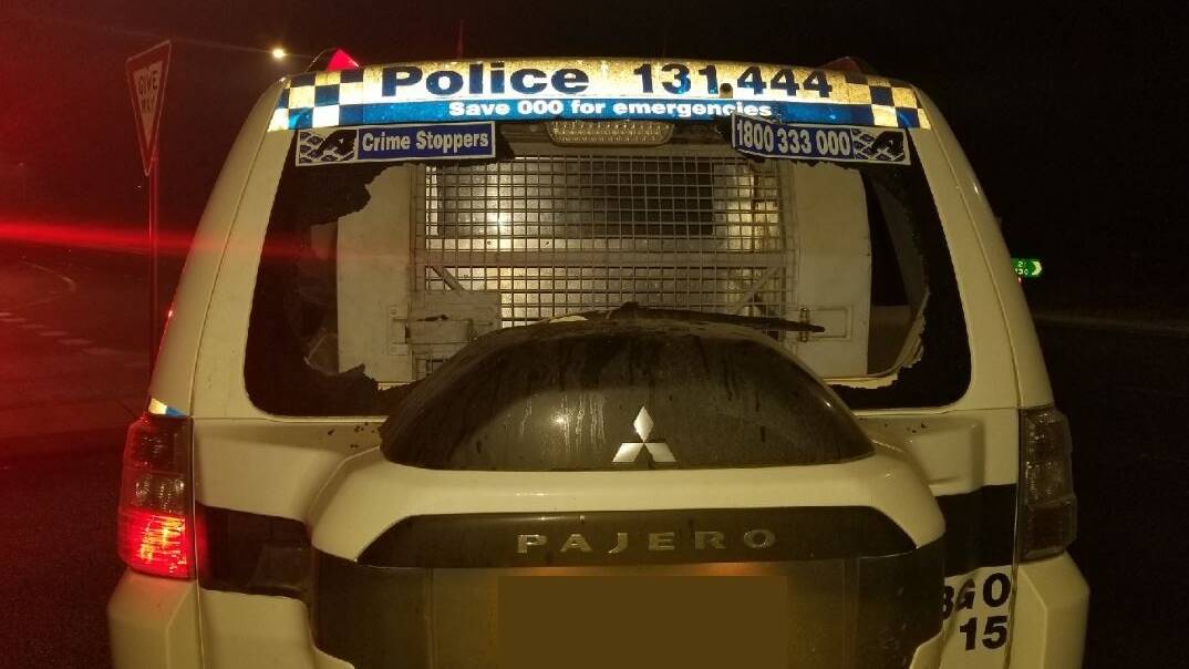 This NSW police 4WD had its rear window smashed by a rock during a public order incident at Sutton on Friday night. Picture: NSW Police Force Facebook page