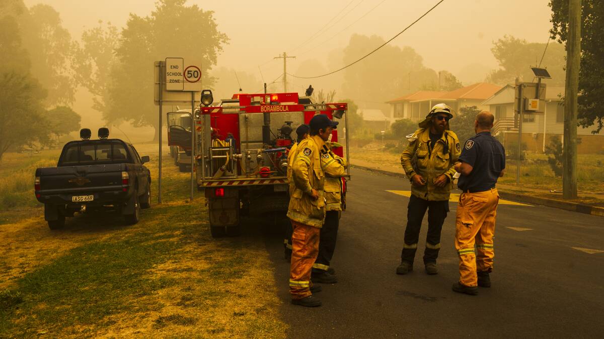 The NSW Rural Fire Service continue property protection in Batlow from the Dunns Road fire on Saturday. Picture: Dion Georgopoulos