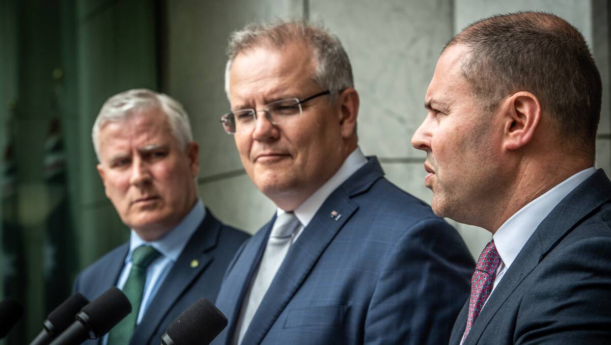 Prime Minister Scott Morrison announcing the bushfire recovery fund during the bushfire crisis, with Deputy Prime Minister Michael McCormack and Treasurer Josh Frydenberg. Picture: Karleen Minney