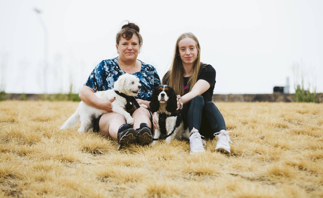 Jenny Gould and her 16-year-old daughter Michaela Smith, along with their two dogs Charlie and Coco, evacuated Sunshine Bay, on the South Coast. Picture: Jamila Toderas