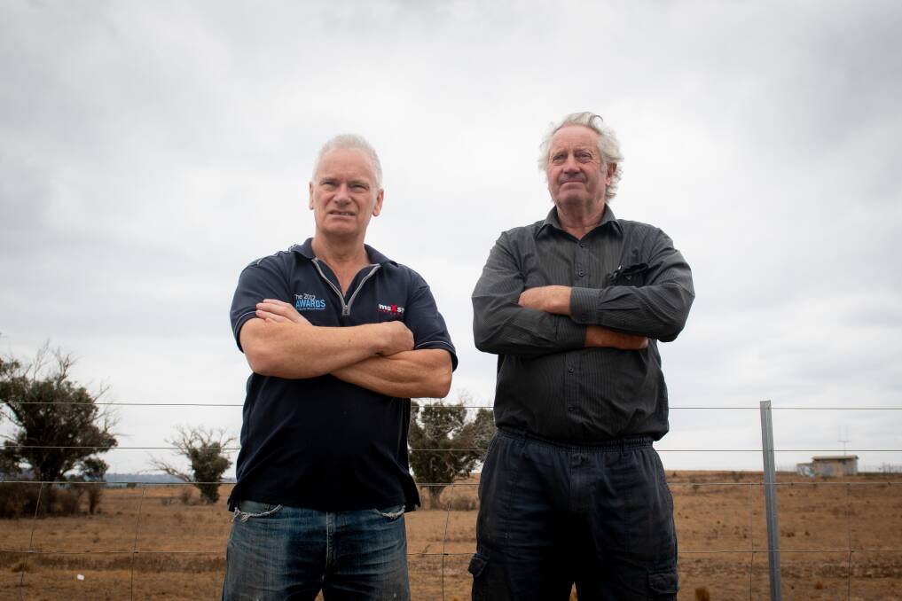 Laurence Buchanan and Wayne West, who lost property in the 2003 bushfires, want assurances information about any fire threat to the ACT will be timely. Picture: Elesa Kurtz
