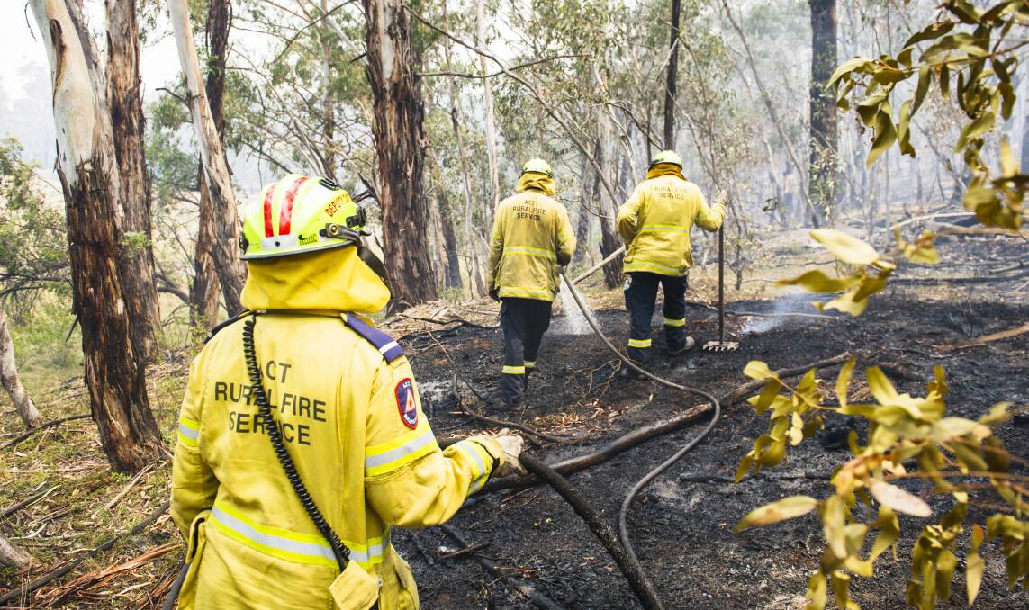 The ACT Gungahlin RFS Brigade clears a spotfire. Picture: Dion Georgopoulos