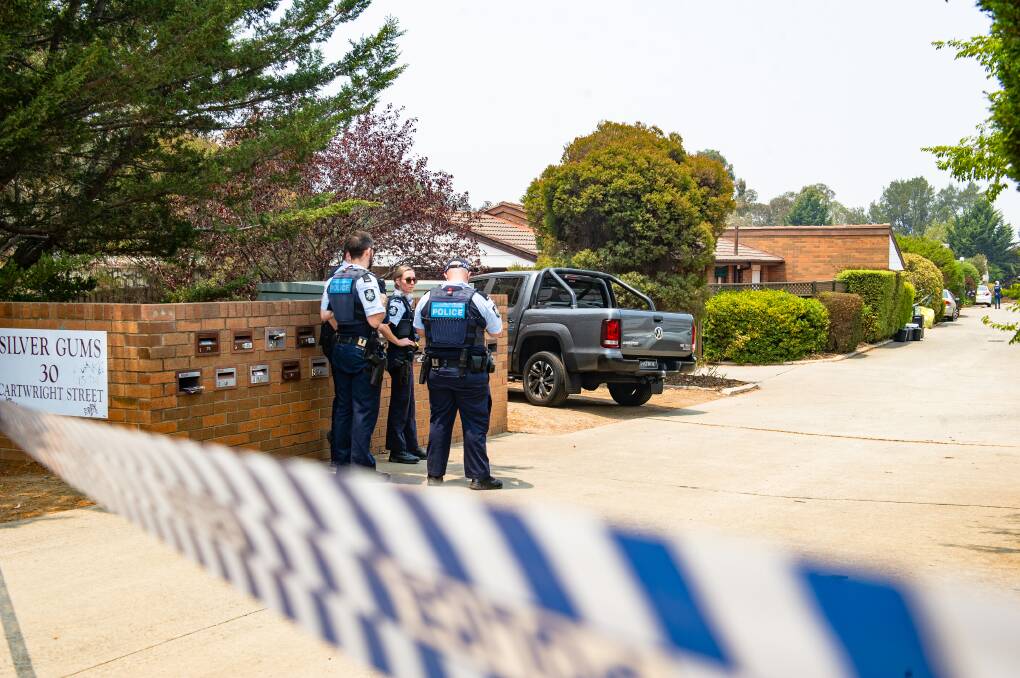 Police at the Charnwood townhouse complex on Saturday morning, where the alleged murder happened. Picture: Elesa Kurtz