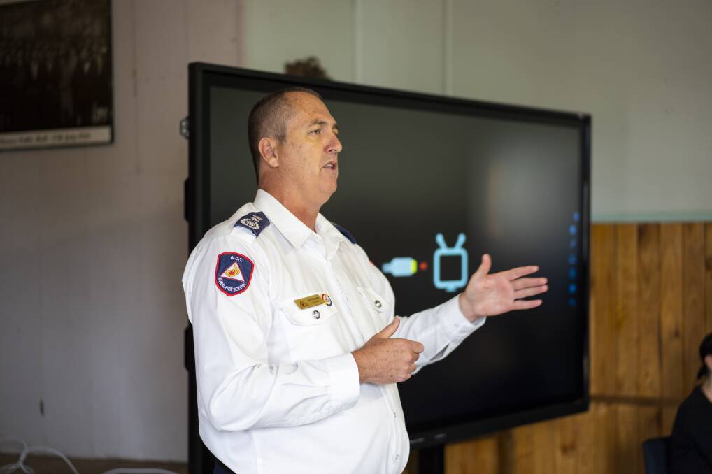 ACT Rural Fire Service chief officer Joe Murphy speaks at a community meeting in Tharwa on Saturday. Picture: Dion Georgopoulos