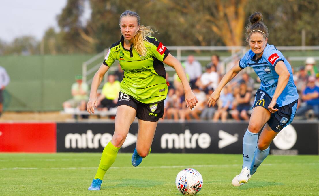Ashlie Crofts [left] has re-signed with Canberra United for the 2020-21 W-League season. Picture: Jamila Toderas