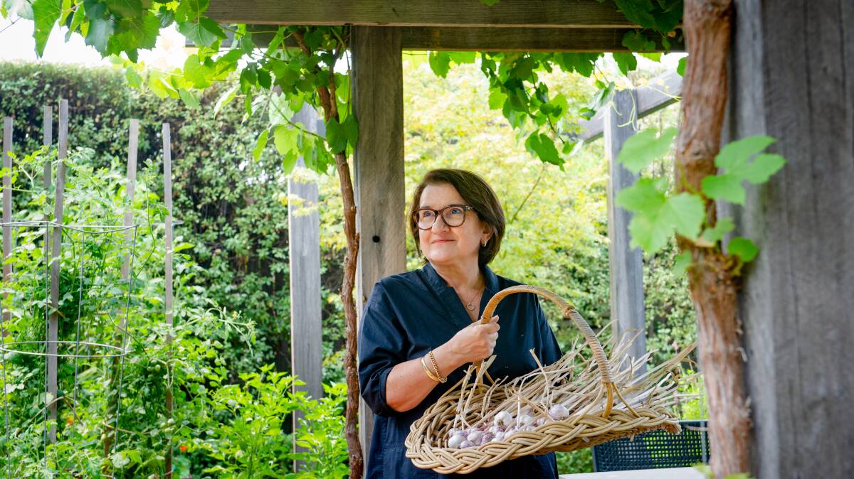 Elena Maginness with garlic grown in her garden. Picture: Elesa Kurtz