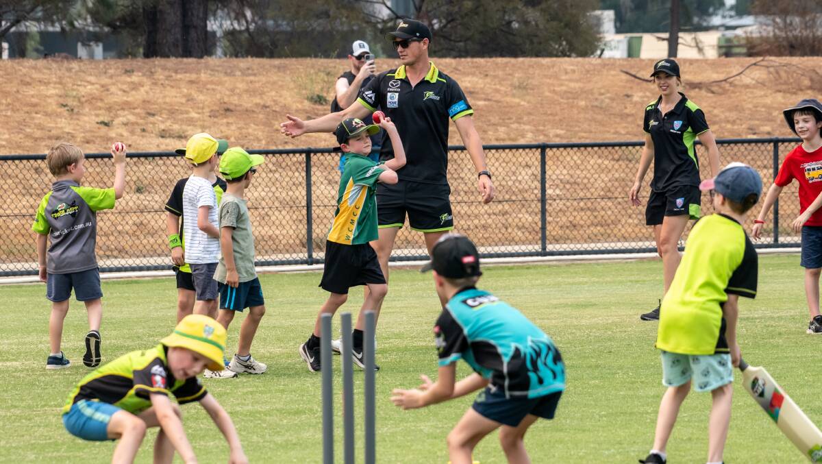 Chris Tremain and fellow Thunder players held a clinic for junior cricketers as the club continues an investment in Canberra. Picture: Karleen Minney.