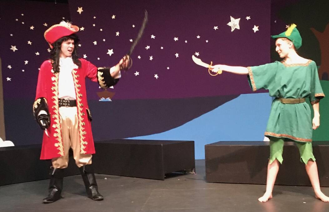 Captain Hook, played by Oliver McLauchlan, 16, and Peter Pan played by Lily Welling, 15, in Peter Pan the Musical by Child Players ACT.