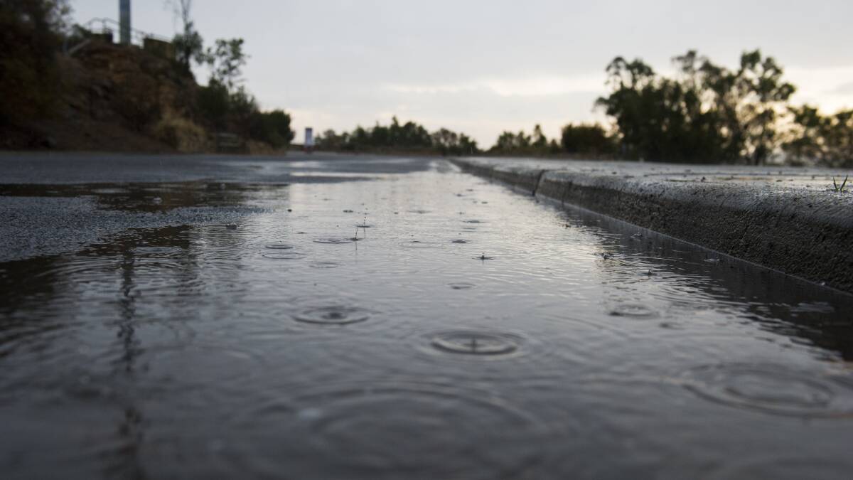 The stormy weather creates puddles at the top of Mt Ainslie. Picture: Dion Georgopoulos