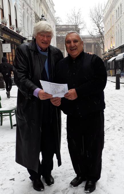 Human rights lawyer Geoffrey Robertson, left, and Albert Buffett in London in 2018, with Mr Buffett's complaint to the United Nations. Mr Buffet, a descendant of Pitcairn Islanders, claims indigenous status on Norfolk Island.