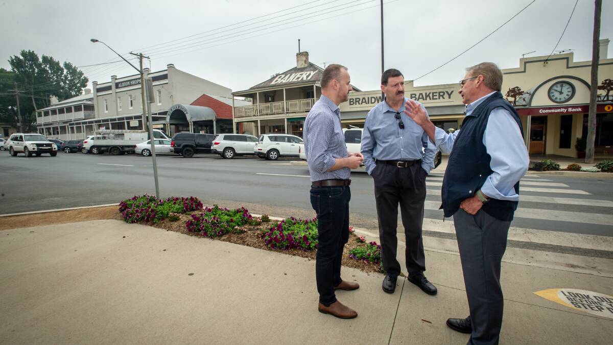 Eden-Monaro MP Mike Kelly (centre) out and about in his electorate, speaking with ACT Chief Minister Andrew Barr and Queanbeyan-Palerang mayor Tim Overall in Braidwood. Picture: Karleen Minney