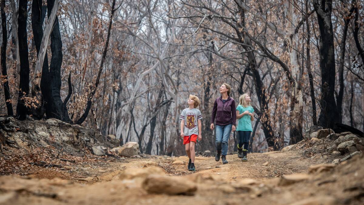 Dr Karen Ford - pictured with children Josh, 12, and Lauren, 9 - lost 260 acres in the Tallaganda fires, as well as many greater gliders. Picture: Karleen Minney