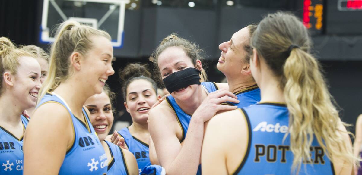 Keely Froling was mobbed by her teammates after hitting the match-winner with a busted nose. Picture: Dion Georgopoulos