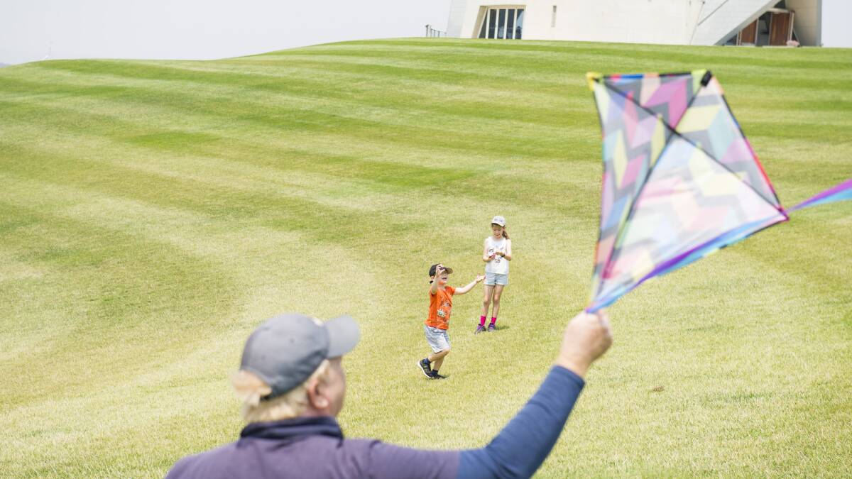 Sammy Elias, 4, and Hannah Elias, 8, flying kites at the National Aboretum. Picture: Dion Georgopoulos