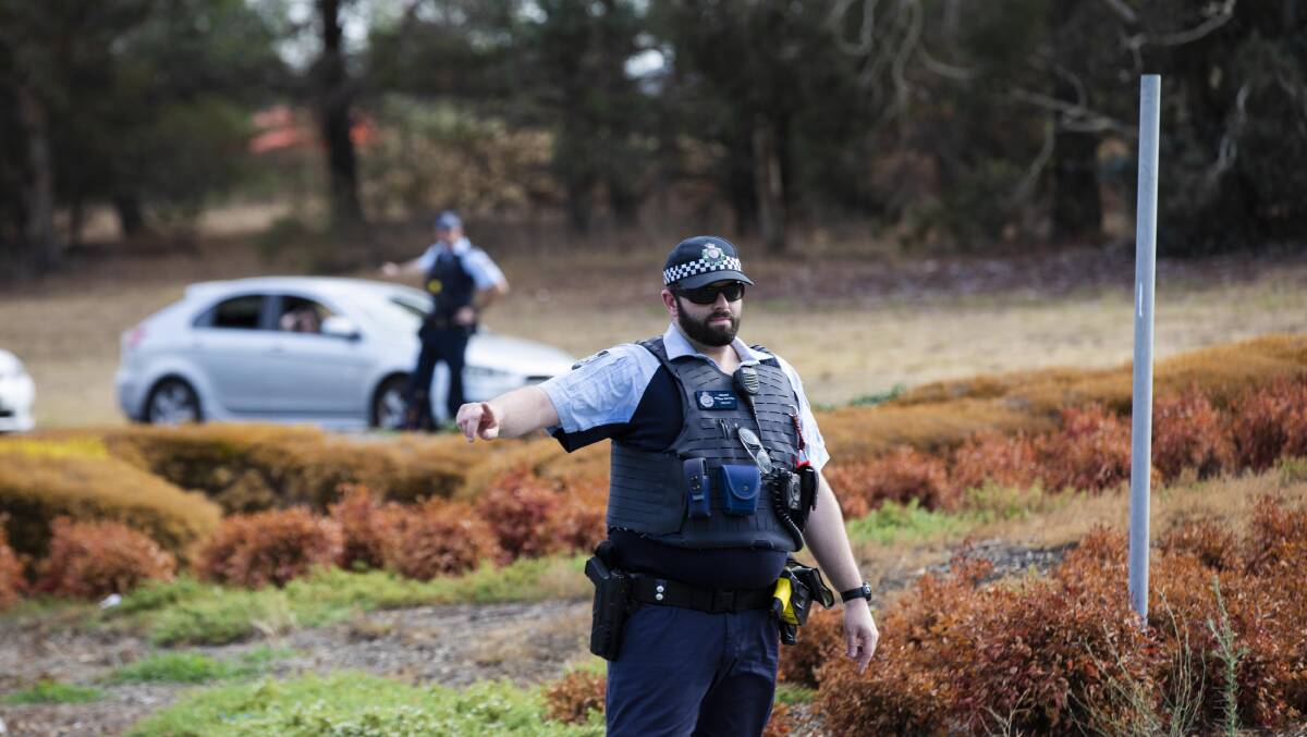 Police directing people away from the Pialligo Redwood Forest fire on January 28. Picture: Jamila Toderas