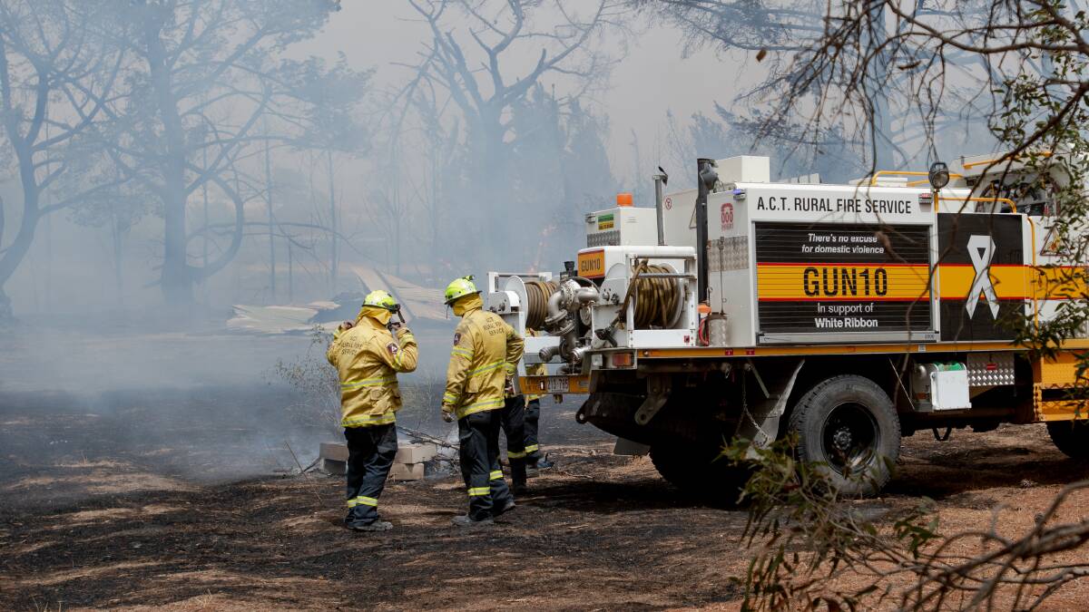 ACT Rural Fire Service volunteers respond to a fire near Pialligo Road. Picture: Elesa Kurtz