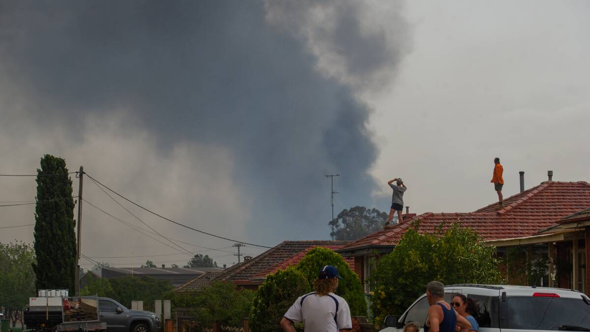 Queanbeyan residents watch the fire approach on January 23. Picture: Elesa Kurtz