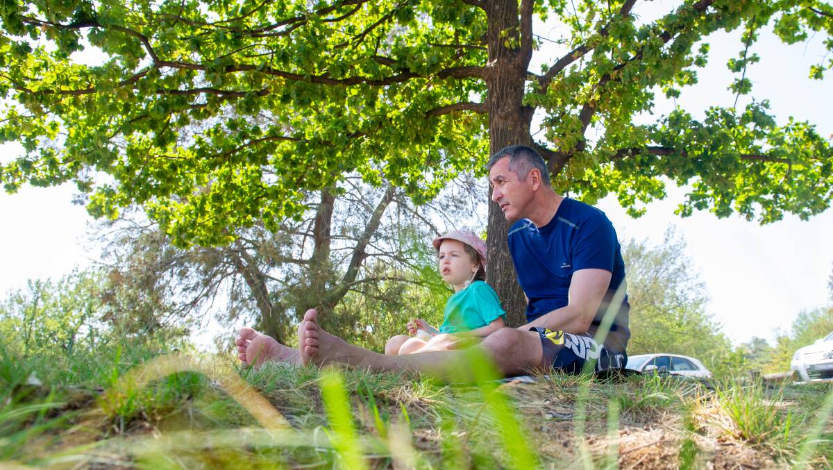 David Holder with his daughter Hazel, 3, of Red Hill, enjoy and morning by Lake Burley Griffin. Picture: Elesa Kurtz
