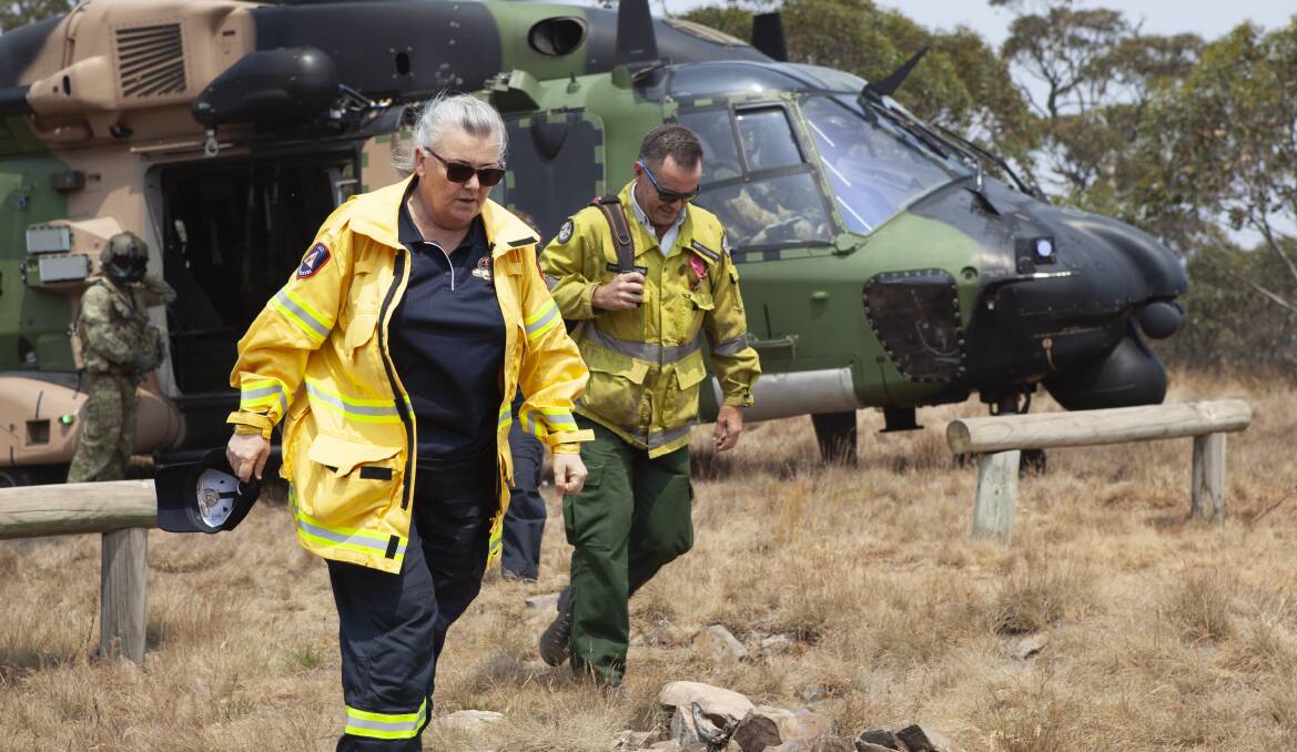 Whelan and McNamara disembark from an MRH-90 Taipan helicopter at Mt Ginini. Picture: Department of Defence