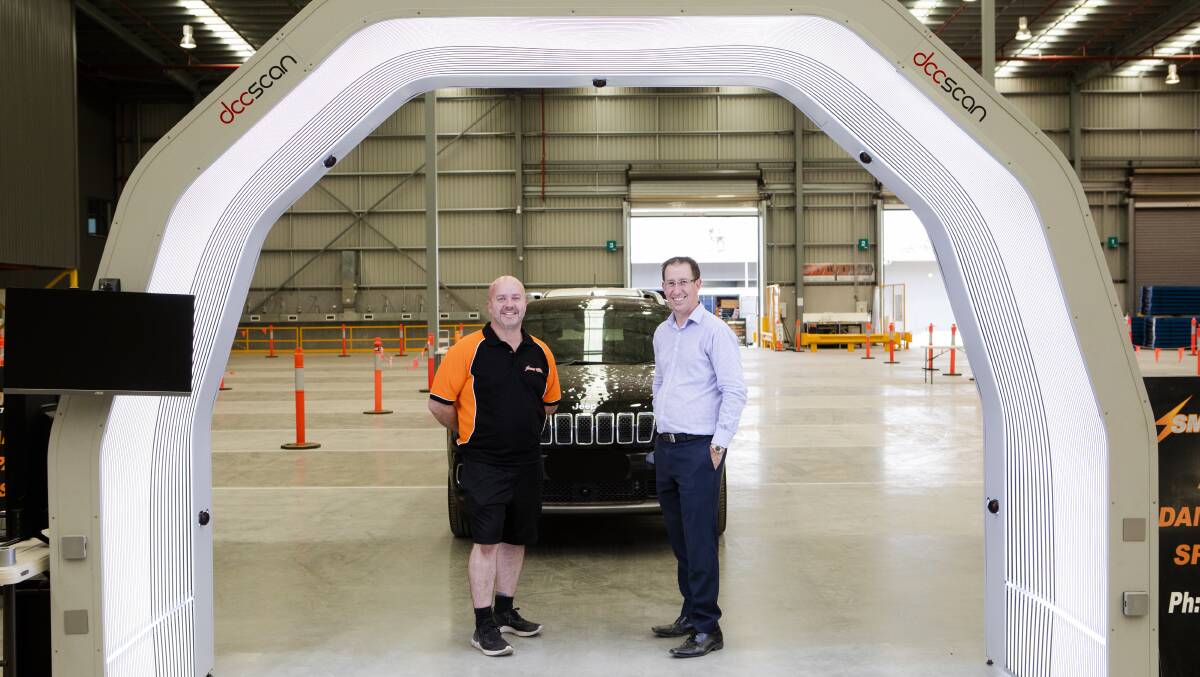 Smart Repair have a $500,000 3-D car scanner set up at the hail damage assessment centre in Hume. From left, Greg Elliott the general manager of Smart Repair, and Martin Kolderie manager of motor vehicle assessing for IAG. Picture: Jamila Toderas