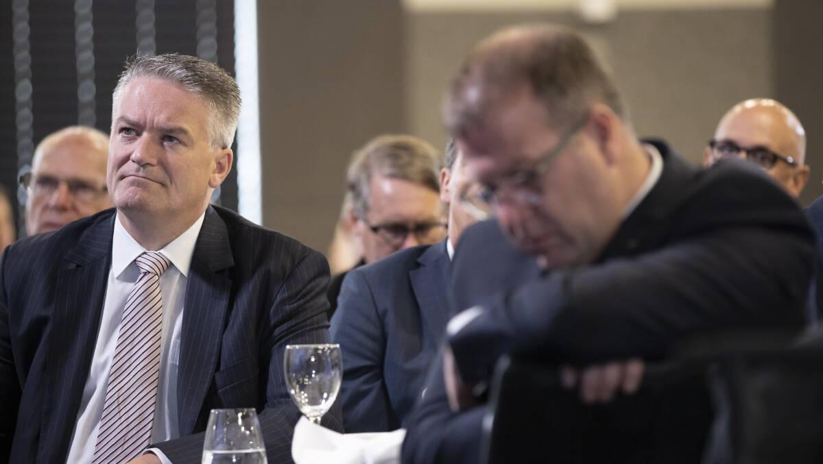 Finance Minister Mathias Cormann listens to Prime Minister Scott Morrison at the National Press Club. Picture: Sitthixay Ditthavong