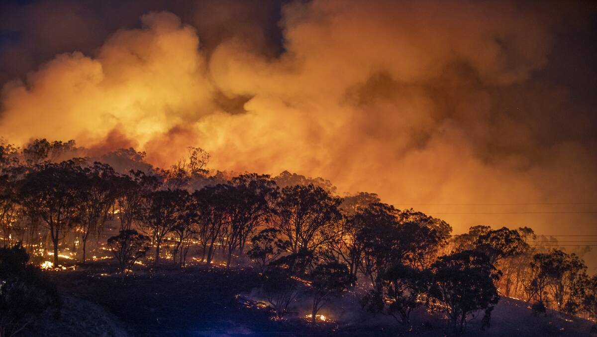 Bushfires threatened Canberra earlier this year. Picture: Sitthixay Ditthavong