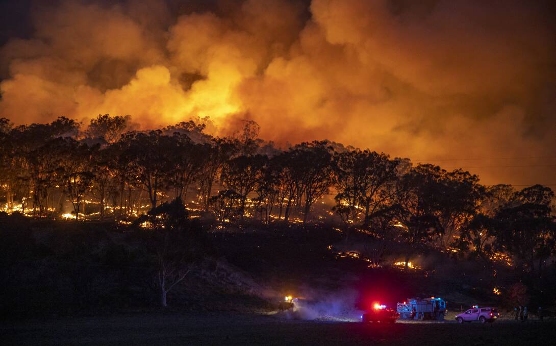 A spot fire from the Clear Ridge bushfire flares up on February 1 in Michelago. Picture: Sitthixay Ditthavong