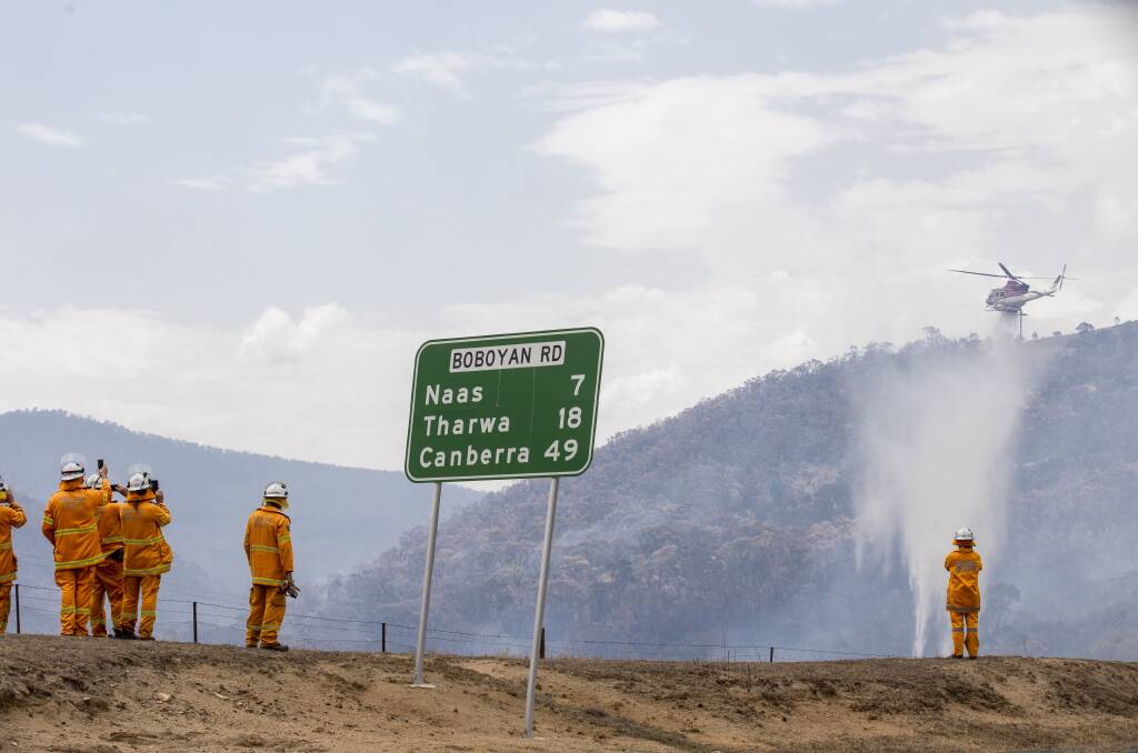 Firefighters near the Orroral Valley fire, which burnt through more than a third of the ACT. Picture: Sitthixay Ditthavong